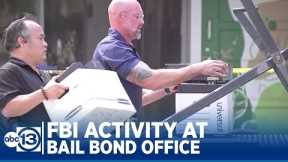 Murder victim's father watches FBI activity at bail bond office
